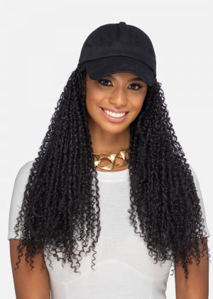 A woman with long hair and a hat.