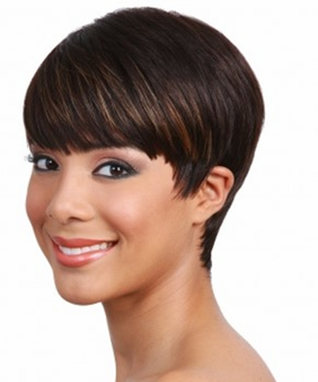 A woman with short hair smiles for the camera.